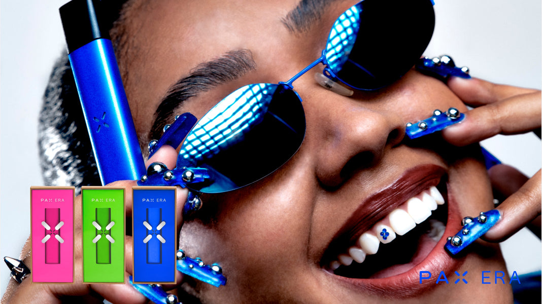 Woman in blue with her matching PAX ERA vape pen