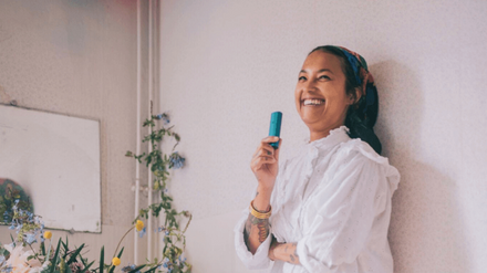 Woman using blue PAX Pod