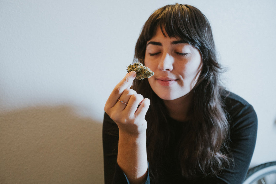 Woman smelling cannabis