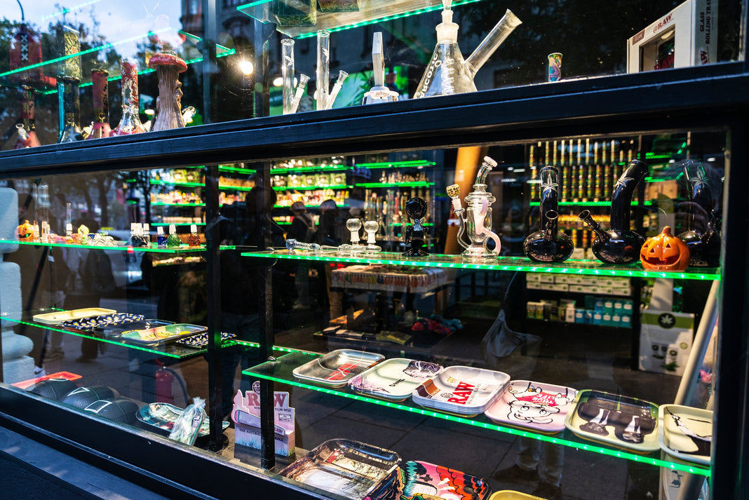 A collection of cannabis accessories in display cases in a shop