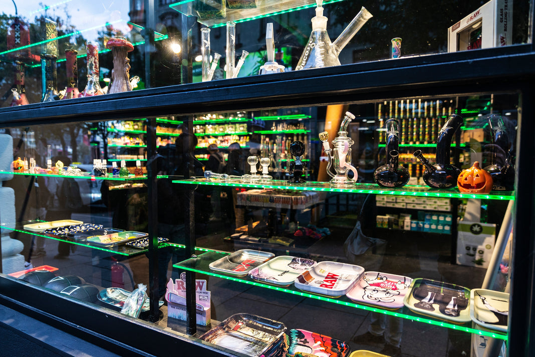 A collection of cannabis accessories in display cases in a shop